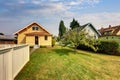 Backyard view of yellow siding craftsman house. Royalty Free Stock Photo