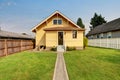 Backyard view of yellow siding craftsman house. Royalty Free Stock Photo