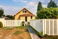 Backyard view of yellow siding craftsman house. Royalty Free Stock Photo