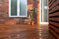 Backyard wooden deck floor boards with fresh brown stain Royalty Free Stock Photo