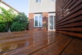 Backyard wooden deck floor boards with fresh brown stain Royalty Free Stock Photo