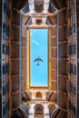 Typical courtyard or backyard of a Budapest apartment building, Historical residential buildings with airplane in the sky Royalty Free Stock Photo