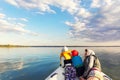 Bacl view two cute adorable little caucasian sibling together with mother wearing lifejacket vest having fun enjoy Royalty Free Stock Photo