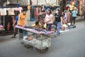 Baclaran, Paranaque, Metro Manila, Philippines - A man pushes an old trolley cart with underwear for sale on top.