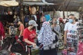 Paranaque, Metro Manila, Philippines - Nov 2021: Two sidewalk vendors have a casual chat.