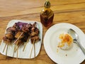 Bacolod Pork Barbecue Sticks and Chicken Oil on Rice Top View Royalty Free Stock Photo