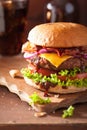 Bacon cheese burger with beef patty tomato onion cola Royalty Free Stock Photo