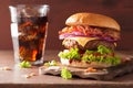 Bacon cheese burger with beef patty tomato onion cola Royalty Free Stock Photo