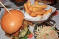 Bacon cheese burger and chunky chips Royalty Free Stock Photo