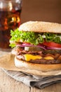 Bacon cheese burger with pickles tomato onion Royalty Free Stock Photo