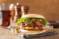 Bacon cheese burger with pickles tomato onion Royalty Free Stock Photo