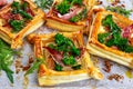 Bacon, cheese, tenderstem broccoli tips puff pastry, with green salad. Royalty Free Stock Photo