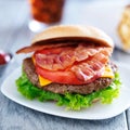 Bacon cheeseburger with fries and cola Royalty Free Stock Photo