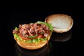 Bacon cheeseburger hamburger isolated on black. BBQ sauce and lettuce. Royalty Free Stock Photo