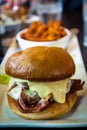 Bacon cheeseburger oozing with spicy ranch sauce Royalty Free Stock Photo