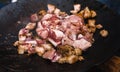 Bacon chop fried on grill in big frying pan