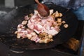 Bacon chop fried on grill in big frying pan