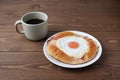 Bacon egg bread on plate and hot coffee isolated on table Royalty Free Stock Photo