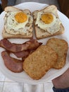 Bacon, Eggs, Hashbrowns and Bread for breakfast Royalty Free Stock Photo