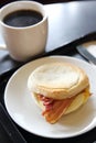 Bacon and fried egg roll with coffee Royalty Free Stock Photo