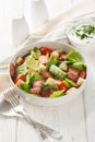 Bacon Lettuce Tomato, BLT salad with creamy dressing sauce, croutons closeup on the plate. Vertical Royalty Free Stock Photo