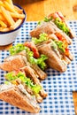 Bacon lettuce tomato sandwich with mayo and fries Royalty Free Stock Photo