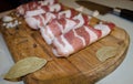 Bacon meat rolls on a wooden board