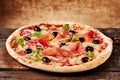 Bacon and olive cheese pizza on old table Royalty Free Stock Photo