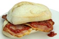 Bacon roll and tomato ketchup. Royalty Free Stock Photo