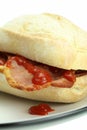 Bacon roll and tomato ketchup. Royalty Free Stock Photo