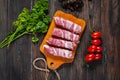 Bacon rolls with tomato, parsley on wooden background Royalty Free Stock Photo