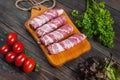 Bacon rolls with tomato, parsley on wooden background Royalty Free Stock Photo