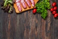 Bacon rolls with tomato, parsley on wooden background. Text place Royalty Free Stock Photo