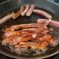 Bacon Sausage Frying Royalty Free Stock Photo