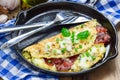 Bacon stuffed omelette with backed beans Royalty Free Stock Photo