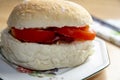 Bacon And Tomato Roll on a side plate Royalty Free Stock Photo