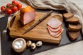 Bacon on wooden board. Quail eggs, tomatoes and bread. Royalty Free Stock Photo