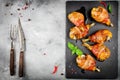 Bacon wrapped chicken legs on a black background Royalty Free Stock Photo