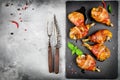 Bacon wrapped chicken legs on a black background Royalty Free Stock Photo