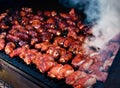 Bacon wrapped shrimp smoking on grill Royalty Free Stock Photo