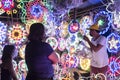 Bacoor, Cavite, Philippines - A lady buys a Christmas parol from a local business stand during the holiday season