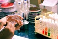 Bacterial Inoculation on a culture plate using inoculation loop by scientist lab technician in microbiology laboratory