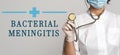 Bacterial Meningitis - concept of text on gray background. Nearby is a cropped view of doctor with stethoscope