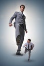 The bad angry boss kicking employee in business concept Royalty Free Stock Photo