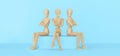 Bad attitude in the team. Social relations and concept of people-three wooden mannequins, sitting with their backs to each other a Royalty Free Stock Photo