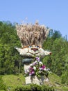 Large figures of Narcissus that grow in Alpine meadows, swim in the lake. Festival Narzissenfest