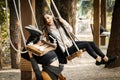 Bad Date. Man fell off the swing, Funny Disappointed Shocked Asian woman Royalty Free Stock Photo