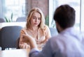 Bad date. Young woman feeling bored during dinner at cafe, unhappy with her boyfriend, disinterested in conversation