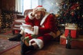 Bad drunk Santa claus reads letters, nasty man