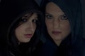 Bad girls with hood in darkness Royalty Free Stock Photo